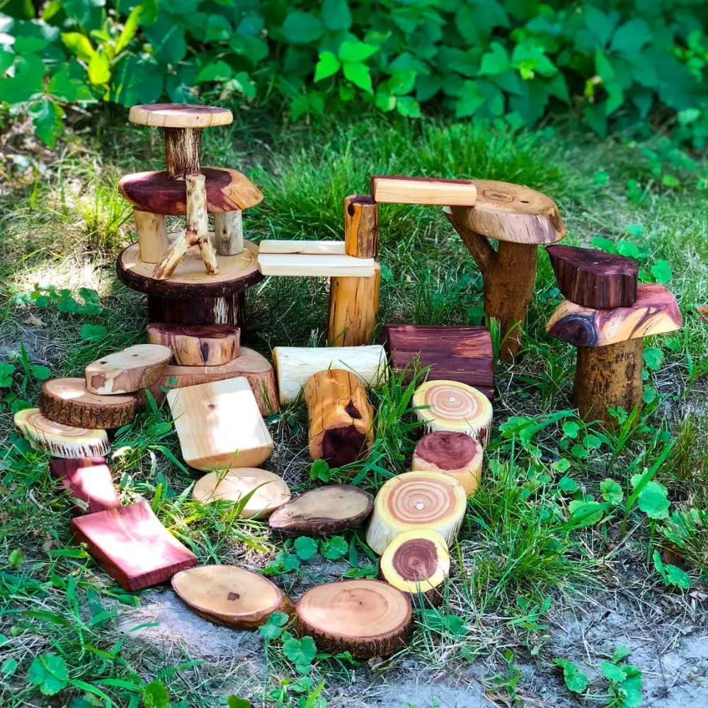 giant wooden tree blocks displayed in nature