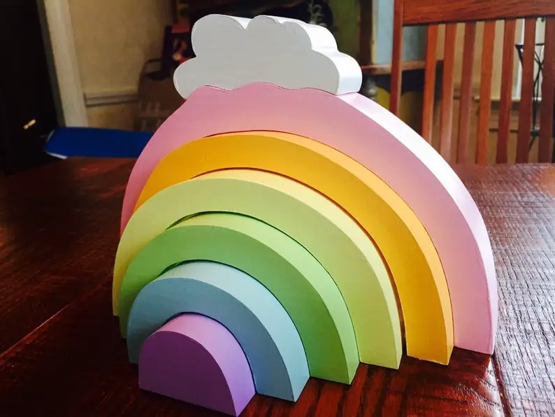 pastel wooden rainbow toy with cloud top