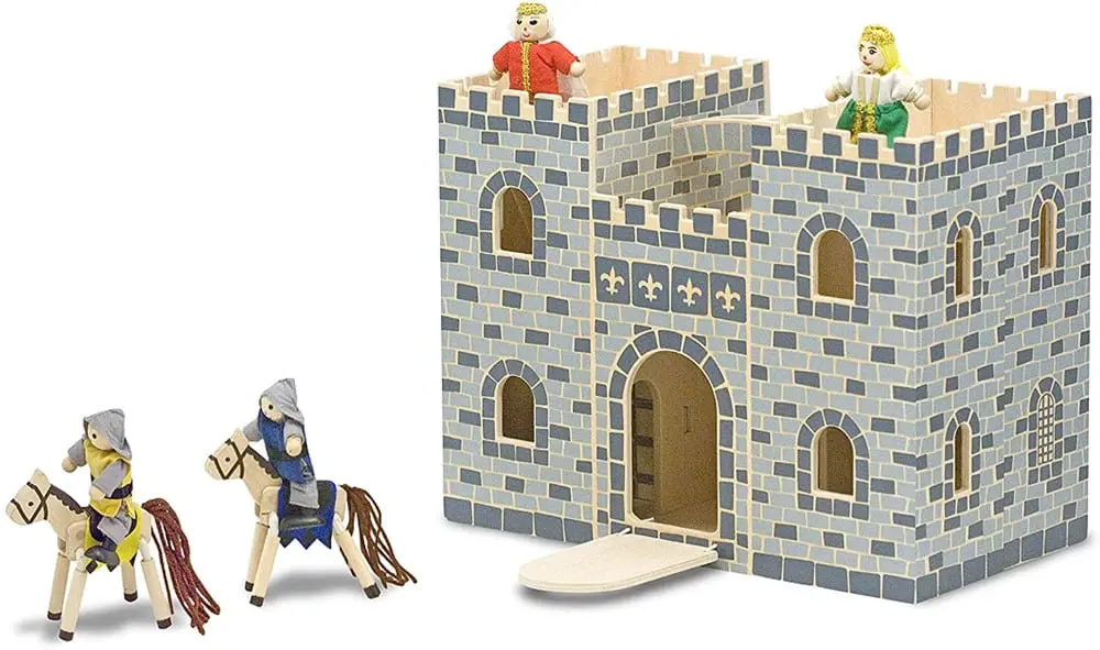 Melissa & Doug brand folding wooden toy castle with figurines including a king, a queen, and some cavalry.