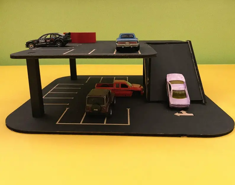 Roadville brand wooden car garage with car track addition.