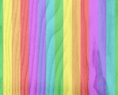 Wooden background with translucent rainbow stripes overlay.