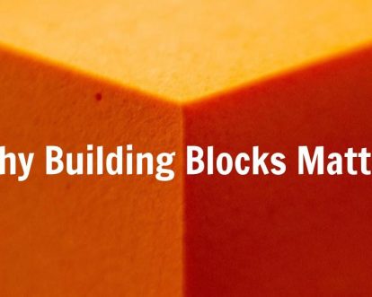 Why building blocks matter on an orange cube.